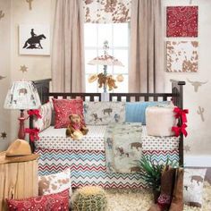 a baby crib is decorated with red, white and blue bedding for christmas