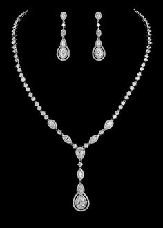 CZ Bridal Jewelry Set nemr3763This glamorous wedding jewelry set features a vintage inspired rhodium silver or, gold plated design. The entire set is adorned with dazzling AAA quality cz round, marquise and teardrop crystals for a breathtaking presentation.   This jewelry set will be a memorable accessory for your wedding day that you can wear for years to come.Size: Necklace - about 16" Long with a 2" long and 5/8" wide front drop. Pierced Earrings are about 1.5" long and .5" wide.Color: Silver Crystal Bridal Jewelry Sets, Bridal Jewelry Sets Brides, Bride Jewelry Set, Vintage Wedding Jewelry, Silver Jewelry Set, Bridal Jewelry Vintage, Bridal Earrings Drop, Bridal Jewelry Set, Bridal Fashion Jewelry