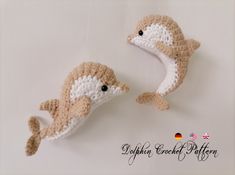 two crocheted sea animals sitting next to each other