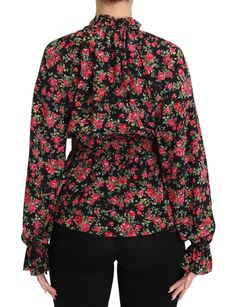 Indulge in the epitome of Italian luxury with this Dolce & Gabbana Black Floral Shirt. Designed for the discerning fashionista, this top features an elasticated waistband that flatters the silhouette, while the exquisite black floral print exudes class. Crafted from the finest silk, this shirt is a testament to superior craftsmanship, ensuring an exclusive addition to your wardrobe. Color: Black Material: 100% Silk Country of Origin: Italy Logo Details Designer Long Sleeve Blouse With Floral Print, Designer V-neck Tops For Fall, Designer Fitted Floral Print Blouse, Designer Fitted Blouse With Floral Print, Designer Black Long Sleeve Blouse, Black Tops With Blouson Sleeves For Formal Occasions, Black Top With Blouson Sleeves For Formal Occasions, Black Formal Top With Blouson Sleeves, Black Blouson Sleeve Top For Formal Occasions