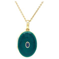 Victor Mayer oval locket pendant 18k yellow gold, translucent emerald green vitreous enamel, guilloche, 1 oval blue sapphire, cabochon, total 0.37 ct, measurements app. 27.5 mm x 21.0 mm About the creator Victor Mayer Victor Mayer is internationally renowned for elegant timeless designs and unrivalled expertise in historic craftsmanship. Lovers of the extraordinary appreciate the beauty of Victor Mayer's designs, which use extremely rare techniques such as genuine enamel or elaborate engravings. Luxury Green Oval Cabochon Necklace, Yellow Gold Enamel Oval Pendant Jewelry, Luxury Yellow Gold Oval Locket Necklace, Classic Oval Enamel Jewelry, Yellow Gold Enamel Oval Jewelry, Oval Locket Necklace In Enamel, Oval Enamel Locket Necklace, Oval Yellow Gold Enamel Jewelry, Oval Enamel Locket Jewelry