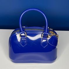 Blue Jelly Satchel Bag, Can Be Worn As Crossbody With Gold Chains Or Carried As Handbag. Trendy Blue Satchel For Summer, Chic Blue Handheld Satchel, Trendy Blue Evening Bag, Blue Summer Bags With Zipper Closure, Summer Blue Bags With Zipper Closure, Chic Blue Satchel With Zipper Closure, Elegant Blue Satchel With Zipper Closure, Bottega Veneta Mini Pouch, Fendi Coat