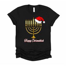 This is a great gift for those families that celebrate both Christmas and hanukkah Bring out a menorah and a christmas tree and wear this design. This t-shirt is everything you've dreamed of and more. It feels soft and lightweight, with the right amount of stretch. It's comfortable and flattering for both men and women. * 100% combed and ring-spun cotton (Heather colors contain polyester) * Heather colors are 52% combed and ring-spun cotton, 48% polyester * Heather Prism colors are 99% combed an Hannukah Menorah, Holiday Graphic Tees, Retro Designs, Menorah, Prism Color, Bella Canvas, Unisex T Shirt, Fabric Weights, Graphic Tee