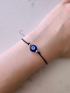 Adjustable evil eye bracelet to protect yourself and loved ones from bad energy. All items are handmade, with a macrame knot closure. Wearing a special evil eye charm, also called a mati, is said to help prevent the curse from even happening 🧿 Cheap Handmade Black Evil Eye Bracelet, How To Make An Evil Eye Bracelet, Casual Evil Eye Beaded Bracelets As Gift, Casual Beaded Evil Eye Bracelet For Gift, Casual Evil Eye Bracelet Perfect For Gifts, Black Spiritual Friendship Bracelets With Evil Eye, Spiritual Black Friendship Bracelets With Evil Eye, Spiritual Black Evil Eye Friendship Bracelets, Spiritual Black Friendship Bracelet With Evil Eye