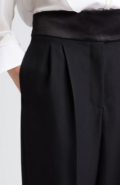 A cummerbund-inspired satin waistband hits a fun and formal note for pleated pants cut from pure wool. 30 1/2" inseam; 20" leg opening; 14" front rise; 16 1/2" back rise (size 42IT) Zip fly with hook-and-bar closure Front slant pockets; back welt pockets 100% wool with 100% polyester contrast Dry clean Imported Designer Clothing Sleek Wide Leg Pants For Evening With Belt Loops, Sleek Wide Leg Pants With Belt Loops For Evening, Classic Wide-leg Pants With Pleated Waist, Formal Silk Straight Leg Wide Pants, Elegant Wide Leg Pants With Pressed Crease For Evening, Elegant Evening Wide Leg Pants With Pressed Crease, Silk Tapered Leg Bottoms For Evening, Formal Wide-leg Pants With Structured Boning, Classic Silk Wide Leg Pants For Evening