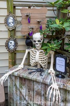 a skeleton sitting on top of a wooden table