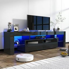 a living room with a large tv on the wall