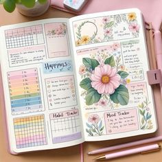 an open planner book with flowers on it