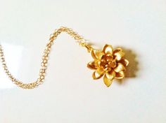 Gold lotus necklace, gold flower necklace,14k gold filled chain  A beautiful golden lotus flower strung onto fine 14k gold filled chain not gold  plated  . A lovely and elegant necklace mom, grandma,mother-in-low, sister,daughter or aany1 you can give as a beautiul gift  Comes in a  gift box nicely wrapped with theribbon  18mm * 18mm gold plated brass lotus. Gold filled chain total 16 inches long, you can choose the length upto 18 inches in no additional charge, just convo me during check out  A Gold Flower Pendant Necklace In 14k Gold Filled, Delicate Gold Flower Necklace As Gift, Delicate Gold Flower Necklace For Gift, 14k Gold Filled Flower Necklace, Gold Necklace With Flower Charm In 14k Gold Filled, Gold-plated Flower Necklace As A Gift, Delicate Gold Flower Necklace As A Gift For Her, Gold Flower Pendant Necklace As Gift For Mom, Gold Flower Shaped Jewelry For Mom