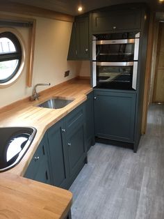 a kitchen with an oven, sink and counter top in it's own home