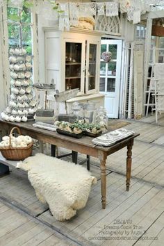 a table that has some food on it in the middle of a room with chairs and tables