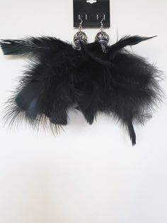 Black feather earrings with black and silver beads Elegant Black Feather Jewelry, Black Feathered Jewelry For Party, Black Feather Jewelry For Party, Bohemian Black Feather Earrings, Black Feathers, Feather Earrings, Black And Silver, Silver Beads, Jewelry Earrings Dangle