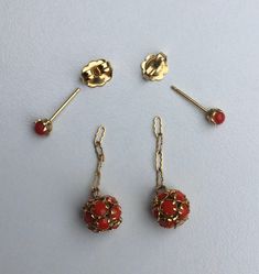 "The past will always return in the fashion world and this piece is back for round two! In the 1920's ladies of class wore the most opulent dresses with jewelry to match. As the years continued, jewelry makers tailored pieces to fashion and trends which resulted in affordability for style. Presenting these Beautiful Vintage 10k Gold Petite Red Stone Set Designer Ball Drop Earrings Featuring Dangled Chain Accents With Elegantly Detailed Designs. Although it's not marked as 10k, it was chemically Vintage 14k Gold Evening Earrings, Red Filigree 14k Gold Jewelry, Red 14k Gold Filigree Jewelry, Red Hallmarked Evening Jewelry, Ball Drop Earrings, Round Two, Ball Drop, Promotional Events, Bow Earrings