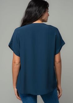 An unbelievably soft and silky hand feel elevates this classic short sleeve top. Featuring a cuffed sleeve, a flattering v-neckline, and a flowy, relaxed fit. Try it loose over jeans for a cool and casual vibe, or tuck it into trousers for a polished look. Silky crepe Relaxed fit V-neckline Short cuffed sleeve Banded collar Split neckline Bohemian top Model is 5'9, wearing a size S.Style: I-13140W-RPL Flowy V-neck Top For Work, Casual V-neck Blouse With Rolled Sleeves, Elegant V-neck Top With Cuffed Sleeves, Solid V-neck T-shirt For Work, Relaxed Fit V-neck T-shirt For Work, Flowy V-neck Top For Workwear, Solid Color Relaxed Fit Short Sleeve V-neck Top, Relaxed Fit Solid Color V-neck Short Sleeve Top, Solid Color Relaxed Fit V-neck Short Sleeve Top