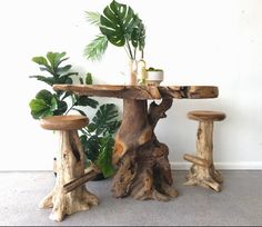 a table and stools made out of tree trunks