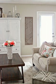 a living room filled with furniture and flowers