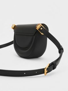 Add elegance and finesse to your everyday style with the latest addition to the cult favourite Koa range, the Koa moon saddle bag in classic black. Featuring an effortlessly chic curved silhouette that adds structure to any outfit, this bag is perfect for days at the office, dinner dates, and everything in between. Fitted with a distinctive square push-lock closure that opens up into two separate compartments, this piece will help you keep your belongings organised and easy to reach. Dinner Dates, The Cult, Charles Keith, Saddle Bag, Half Moon, Everyday Style, Saddle Bags, Classic Black, The Office