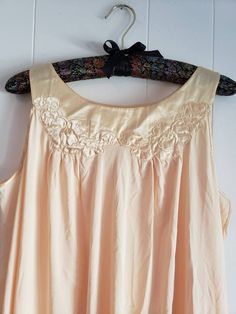 This is a vintage Gossard Artemis nightgown. This piece is sleeveless and is a very pretty shade of pale yellow. There are floral appliques and a satin hem and trim. This piece is labeled a size small, but I think it can fit a larger size than that. There is a small speck and a minor tug in this nightgown. You can see this in the images. The price reflects this. The measurements are as follow: (All measurements taken flat.) Please compare the measurements to your own well fitting clothes as I do Beige Sleeveless Sleepwear For Wedding Night, Sleeveless Beige Sleep Dress, Sleeveless Cream Nightgown For Wedding, Cream Sleeveless Sleepwear For Wedding Night, Cream Sleeveless Nightgown With Lace Trim, Vintage Cream Sleeveless Sleepwear, Cream Sleeveless Sleepwear With Lace Trim, Vintage Sleeveless Wedding Nightgown, Sleeveless Cream Sleepwear For Spring