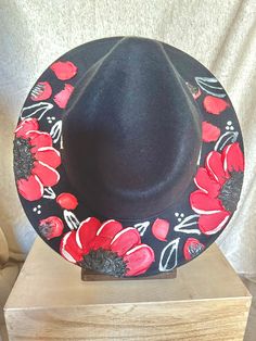 This one of a kind, hand painted, textured floral fedora is the perfect walking art piece. Each hat is uniquely crafted and perfect for any occasion.  This black fedora is crafted with reds, black, and white flowers and has metallic silver accents. These island treasures are shipped straight to you from the Hawaiian island of Oahu. (Hats are water resistant. Keep out of heavy rain. Spot clean only) Boho 2024, Walking Art, Black Fedora, Flower Hat, Black And White Flowers, Heavy Rain, Flower Hats, Hawaiian Islands, Silver Accents