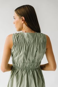 Get ready to turn heads in The Laserna Tie Detail Midi Dress in Sage! This stunning dress features a unique tie detail that adds a touch of elegance to the classic midi style. Perfect for any occasion, this dress will make you feel confident and stylish. Don't miss out on this must-have piece for your wardrobe! Details self/lining: 100% cotton Fabric Care Guide Here Sizing & Fit Measurements are approximate and taken while laying flat across the front. Not doubled. small: bust = 18"; waist = 14" Chic Midi Dress With Gathered Waist, Spring Midi Dress With Gathered Neckline For Date Night, Spring Date Night Midi Dress With Gathered Neckline, Spring Midi Dress With Gathered Waist For Date Night, Chic Midi Dress With Tie Fastening, Spring Midi Dress With Smocked Back For Work, Midi-length Maxi Dress With Gathered Neckline For Day Out, Spring Midi Dress With Tie Straps For Date Night, Chic Maxi Dress With Tie Fastening For Daywear