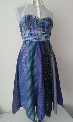 A fully lined and boned strapless dress with an attached skirt of Silk ties. Zip fastening at the back. Shades of Purple and Blue. Length of the dress hangs under the knees and is very comfortable. Flattering fit that has both a feminine and masculine finish Bust 34, Waist 28 inches. Feminine And Masculine, Shades Of Purple, Silk Ties, Clothing Items, Strapless Dress, Blue And Purple, The Dress, Silk, Purple