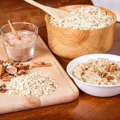 oatmeal and cinnamon sticks on a cutting board next to a bowl of granola