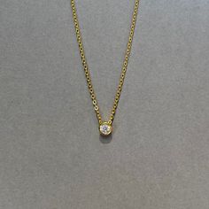 Our bezel solitaire necklace is available in sterling silver or 14KT gold vermeil. Materials: 925 sterling silver or 14KT gold vermeil Vermeil: 14KT yellow gold plating over 925 sterling silver Gemstone: Cubic Zirconia Closure: Spring ring Length: Adjustable length 16" to 18" Follow us on Instagram @pennyweightsjewelry Follow us on Facebook @facebook.com/pennyweights Follow us on Pinterest @pennyweights Click on the links at the bottom left of this page! Gold Birthstone Necklace With Bezel Setting, Gold Round Stone Birthstone Necklace, Gold Birthstone Necklace With Round Stone, Gold Birthstone Necklace Fine Jewelry, Gold Fine Jewelry Birthstone Necklace, Yellow Gold Necklace With Round Stone For Everyday, Everyday Yellow Gold Necklace With Round Stone, Gold Round Cut Birthstone Necklace In Fine Jewelry Style, Gold Round Cut Birthstone Necklace Fine Jewelry