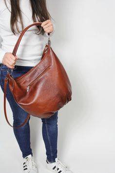 Leather hobo bag - Top zipper closure bag DIMENSIONS: Height: 13.4 in (34 cm) Max width: 16,9 in (43 cm) Bottom: 8x3.6 in (20x9 cm) Short strap: 18.5 in (47 cm) Long Strap: max 43 in (110 cm) Large hobo bag made from high quality leather. This leather handbag can be worn on your shoulder, on the forearm or in your hand. This leather bag is a perfect everyday bag! There is a lot of space and you can put there everything in your everyday life. Includes internal pockets for mobile phone and other s Everyday Hobo Bag With Zipper Closure, Leather Hobo Bag With Zipper Closure, Brown Hobo Shoulder Bag With Zipper Closure, Versatile Hobo Bag With Zipper Closure, On-the-go Hobo Bag With Zipper Pocket, Everyday Hobo Bucket Bag With Zipper, Everyday Hobo Bucket Bag With Zipper Closure, Hobo Bag With Zipper Closure For On-the-go, Hobo Bag With Zipper Pocket For Daily Use