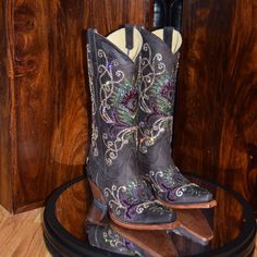 "Tony Lama handcrafted western boots   - Rich expresso leather upper  - Beautiful, colorful stitching detail accented with 4,900 Swarovski crystals applied by hand  - Smooth leather lining  - Cushioned insole  - Snip toe  - 2 1/2\" heel" Western Snip Toe Boots With Rhinestones, Western Boots With Rhinestones And Snip Toe, Multicolor Western Boots With Snip Toe, Western Style Snip Toe Boots With Rhinestones, Embellished Leather Boots With Snip Toe, Western Embellished Snip Toe Boots, Western Leather Embellished Boots, Western Style Embellished Leather Boots, High Cowboy Boots