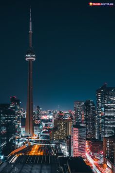 the city skyline is lit up at night with lights from all over the world and skyscrapers in the background