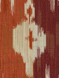 an orange, white and brown pattern on fabric