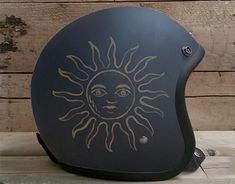 a helmet with the sun drawn on it