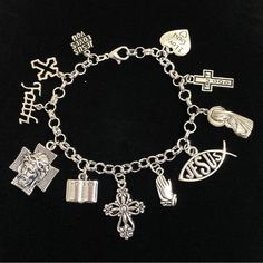 New. This Bracelet Makes A Perfect Gift Has 11 Religious Christian Themed Charms Stainless Steel Bracelet Has A Lobster Clasp Closure Measures Approx 8” Bracelet And Charms Are Silver Tone Alloy And Steel. Charms Include Jesus Loves You, Cross, Faith, Jesus Face On Cross, Bible, Cross, Praying Hands, Jesus Fish, Mother Mary Holding Baby Jesus, Trust God Cross, I Love God Heart God Bracelet, God Cross, Bible Cross, I Love God, Graduation 2024, God's Heart, Jesus Face, Praying Hands, Holding Baby