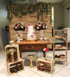 the table is decorated with flowers and vases