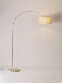 a floor lamp with a white shade on the side and a light that is attached to it