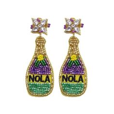 two earrings with the word nola on them