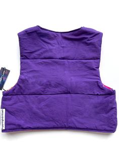 Upcycled mini cropped patchwork quilted vest with snap buttons. Made from secondhand bandanas and sheets. Metal snap buttons. Reversible! Bandana patchwork side one, basic statement purple side 2. Filled with polyester insulation for a lightweight puffer. Size small. Fits up to 34” bust. 17” long. Fitted Casual Purple Vest, Casual Fitted Purple Vest, Mini Patchwork, Quilted Puffer Vest, Quilted Vest, Patchwork Quilt, Puffer Vest, Bandanas, Patchwork Quilts