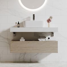 there is a sink and mirror in the bathroom with white tiles on the wall behind it