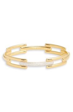 Link-inspired bars give sleek structure to a sterling silver bangle plated in 18-karat gold and lit up with lab-created diamond pavé. Exclusive US retailer Small=6”, Medium=6 1/2” inner circumference; 3/8" width Total lab-created diamond weight: 0.37–0.43ct. Clarity: VS Sterling silver/18k-gold plate/lab-created diamond Imported >Diamond Guide Modern Diamond Bracelet With Pave Setting, Modern Gold Cuff Bracelet With Diamond Accents, Modern Gold Bracelet With Pave Setting, Modern Gold Bangle With Pave Setting, Sterling Silver Bangle, Diamond Guide, Monica Vinader, Diamond Bangle, Sterling Silver Bangles