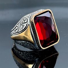 Silver Ruby Stone Ring , Man Handmade Ruby Stone Ring , Engraved Ruby Red Stone Ring , Father Day , Ottoman Style Ring , 925k Silver Ring ★Item Details * Gender : Male / Female * Material : 925K Sterling Silver * Total weight : 17 Grams * Gemstone : Ruby  Stone ✔ Ready to Ship in 1-2 Business Days .. ✔ Shipped to the Worldwide 1-5 business days with free shipping... ✔ The product will be sent to you with a handmade wooden box to avoid any damage during shipping... ✔ Visit our store, browse other Men's jewelry, silver and gold collections, and find the perfect piece you're looking for... Click For Our Other Products https://www.etsy.com/shop/MercansilverTR?ref=simple-shop-header-name&listing_id=1003010735 Ruby Stone Ring, Red Stone Ring, Handmade Wooden Boxes, Ring Man, Ottoman Styling, Ruby Stone, Gold Collection, Red Stone, Ruby Red