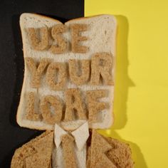 a piece of bread with the words use your love on it and a man in a suit