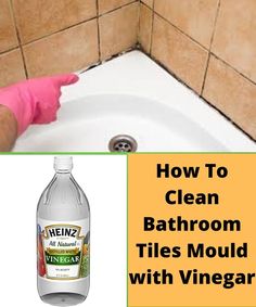 a bottle of vinegar next to a bathtub with the words how to clean bathroom tiles mould with vinegar