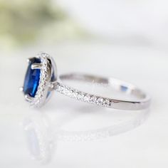 Gorgeous Blue Sapphire Ring ►Made of Sterling Silver with rhodium finish (925) ►Accented with Simulated Diamonds (cz) Center Stone: Sapphire Color: Blue Stone Cut: Oval Gem size: 8.0 x 6.0 mm Gemstone Creation: 100% genuine Lab-Grown sapphire ►Handling time: 1-2 business days ►Free domestic USA shipping ►Wrapped & ready to give in a beautiful box. Classic Sapphire Birthstone Promise Ring, Classic Sapphire Diamond Birthstone Ring, Blue Halo Setting Birthstone Ring For Anniversary, Cushion Cut Sapphire Ring With Center Stone As Gift, Blue Birthstone Ring With Halo Setting For Anniversary, Classic Gemstone Birthstone Ring For Promise, Classic Promise Ring With Birthstone Gemstone, Classic Birthstone Ring For Promise, Formal Rings With Lab-created Sapphire Birthstone