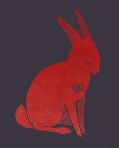 a red rabbit sitting on top of a black background