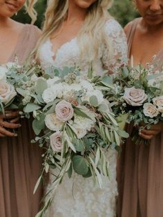 the bridesmaids are holding their bouquets with greenery and flowers on them