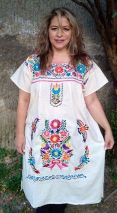 Beautiful and cool Mexican embroidered dress, with a chic touch, ideal to look at the beach, themed events, cool, comfortable and elegant Mexican huipil. Boho dress sizes 2XL BUST 54 INCHES HIPS 56 INCHES Long 42 inches Size 4XL Bust 58 inches Waist 66 inches Length 42 inches The wonderful thing about this dress model is its comfort and elegance. Ideal for women of any age. It has no age exclusivity. Every woman looks beautiful in this type of dress. It is a cheerful dress, cool, suitable for any occasion. It has beautiful embroidered colors. I love working with the blanket, it is fresh and comfortable, the embroidered is combined with beautiful colors. Short Sleeve Embroidered Dresses For Beach Season, Traditional Floral Embroidered Dress For Vacation, Summer Embroidered Boho Hippie Dress, Embroidered Boho Hippie Dress For Summer, Summer Short Sleeve Dress With Geometric Embroidery, Short Sleeve Embroidered Dress With Geometric Patterns For Summer, Embroidered Short Sleeve Beach Cover-up Dress, Casual Embroidered Boho Dress For Beach, Casual Embroidered Dress For Beach