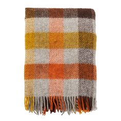 an orange, yellow and white plaid blanket with fringes on the ends is shown