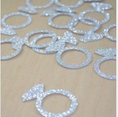 silver glitter numbers are arranged on a table