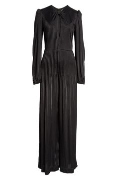 This balloon-sleeve jumpsuit gets an elevated vibe from puffed shoulders and flowy wide legs while a plunging front cutout brings a hint of flirtation to your look. The supersoft jersey fabric gets a little bit of texture from perfectly placed pleats. 54" length; 26" inseam; 39" leg opening (size Medium) Hidden back-zip closure Jewel neck Long sleeves with elastic cuffs Partially lined 100% viscose Hand wash, line dry Imported FARM Rio will plant one tree for every purchase of its product as a p Chic Evening Jumpsuits And Rompers For Fall, Sleek Evening Jumpsuits And Rompers For Fall, Chic Pleated Jumpsuits And Rompers For Evening, Chic Pleated Evening Jumpsuits And Rompers, Elegant Fitted Pleated Jumpsuits And Rompers, Spring Evening Long Sleeve Jumpsuits And Rompers, Evening Long Sleeve Jumpsuits And Rompers For Spring, Elegant Pleated Jumpsuits And Rompers For Party, Satin Jumpsuit