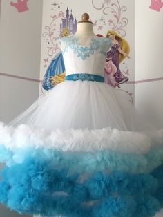 Gorgeous custom made white and light blue girls dress. Multi layered skirt with ruffles in white ,light blue, blue colors. The corset and belt are decorated with lace and pearls. Zipper and lacing back. Fabric: satin, high quality tulle. Colors: White, Light blue, blue. Gloves are included. Size 5-6 ( chest 26 waist 24-25 length from shoulder to hem 40-41 ). Can be made any size. Light Blue Ruffled Tutu Dress For Wedding, Princess Style Ball Gown With Ruffles For First Communion, White Princess Dress For Quinceanera, White Princess Ball Gown Dress, Princess Style White Quinceanera Dress, Blue Princess Dress With Ruffles For Wedding, White Princess Dress With Ruffles, White Pageant Dress With Ruffles, White Ruffled Ball Gown For Pageants